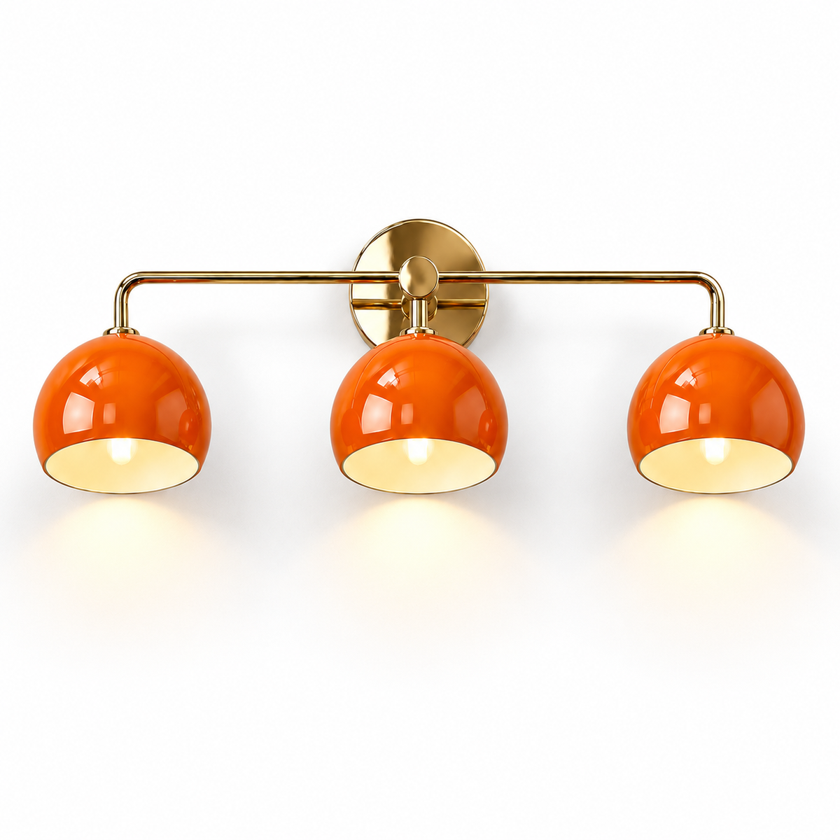 3-light wall sconce with orange dome shades and brass frame