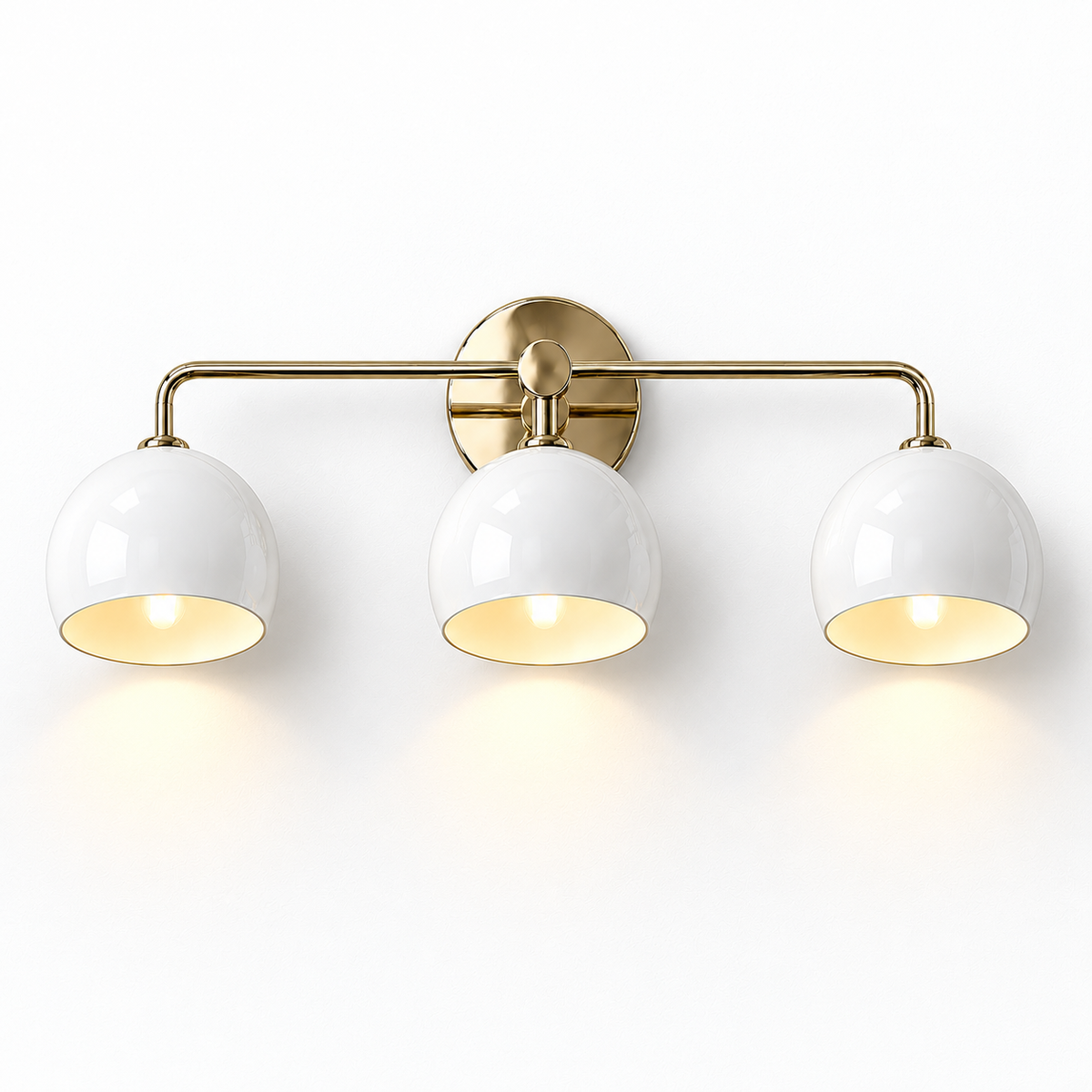 3-light wall sconce with white dome shades and brass frame